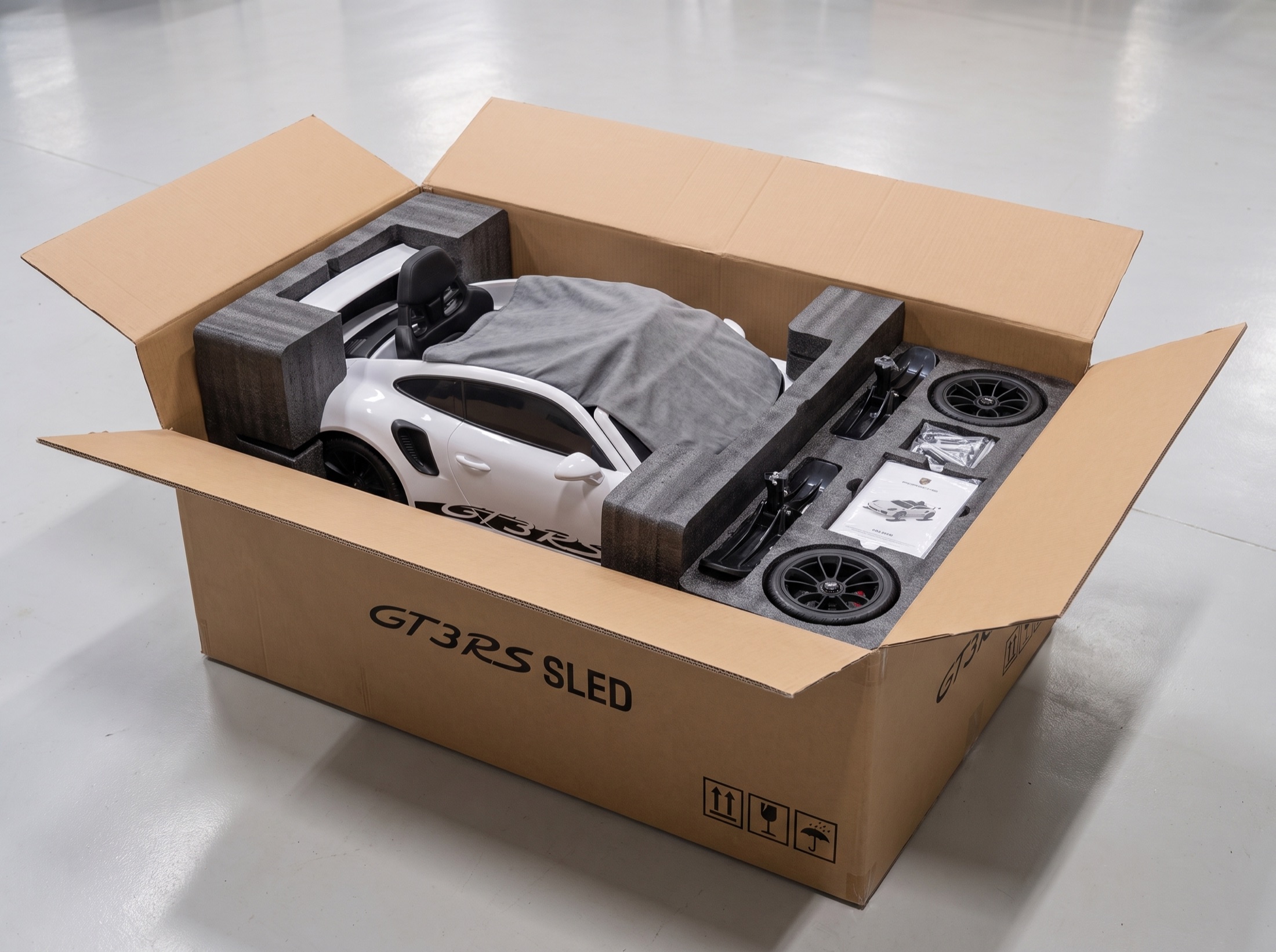 Packaging concept showing an Apex Sled protected with fitted foam